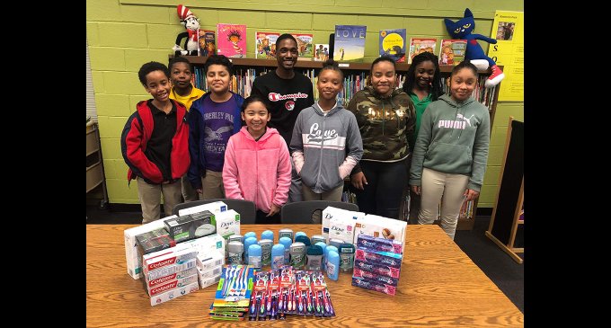 Young Democrats make donations to students at Kimberley Park
