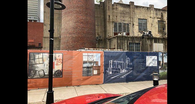 Local artist adds pizzazz to construction fences