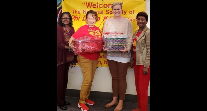 Education sorority meets with Family Services Domestic Violence Shelter representative