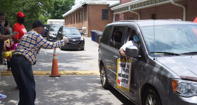 Pastor celebrated with drive-by parade
