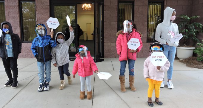 Children model proper mask-wearing behavior