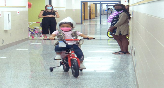 Students receive new bikes for achieving reading goals