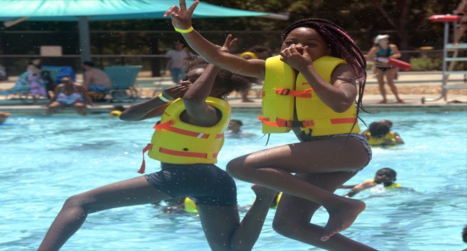 Marva Reid treats local children to a day at the water park