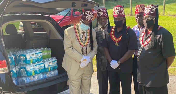 Shriners donate bottles of water to local homeless shelter