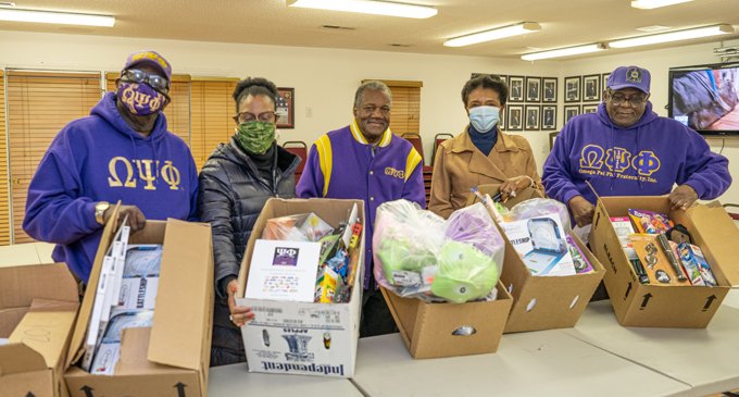 Omega Psi Phi chapters distribute toys throughout community